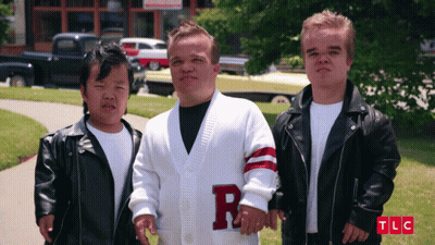Man In White Sweater With Letter R On Sleeve GIF