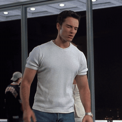 Man In White T-Shirt And Blue Jeans By Window GIF
