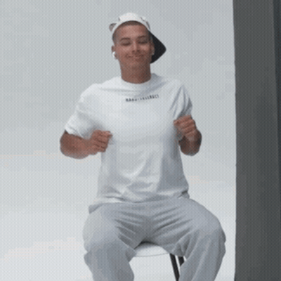 Man In White T-Shirt And Hat Smiling GIF