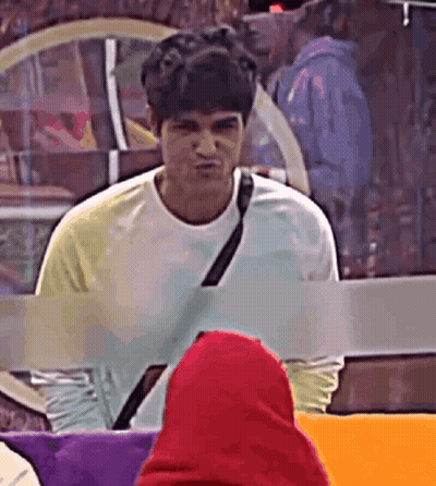 Man In White T-Shirt Facing Woman In Red Hoodie GIF