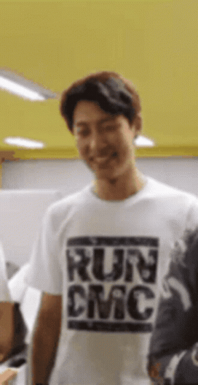 Man In White T-Shirt Saying Run DMC Smiling GIF