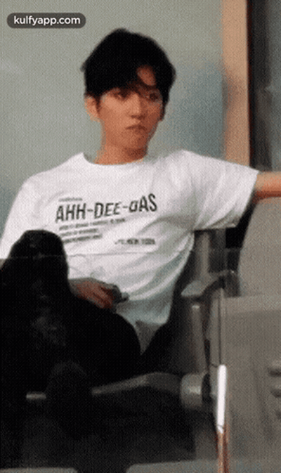 Man In White T-Shirt Sitting GIF