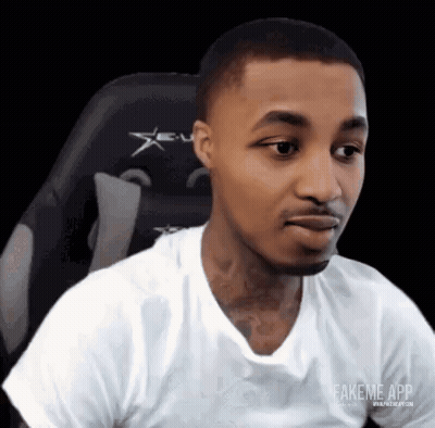 Man In White T-Shirt Sitting Making Funny Face GIF