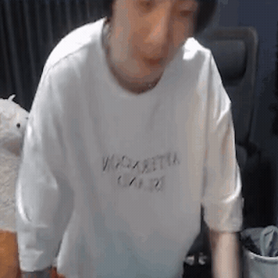Man In White T-Shirt Standing By Chair GIF