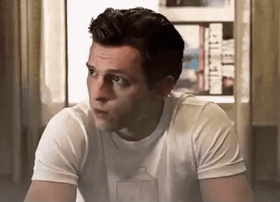 Man In White T-Shirt With Milk Carton Sitting By Window GIF