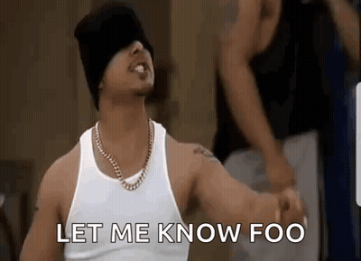 Man In White Tank Top And Black Beanie Saying Let Me Know Foo GIF