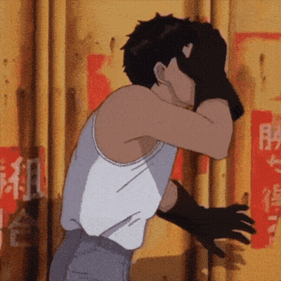 Man In White Tank Top And Black Gloves Covering Face GIF