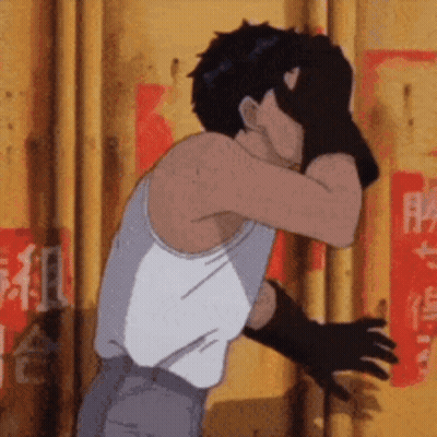 Man In White Tank Top And Black Gloves Covering Face GIF
