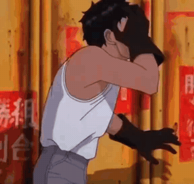 Man In White Tank Top And Black Gloves Covering Face GIF