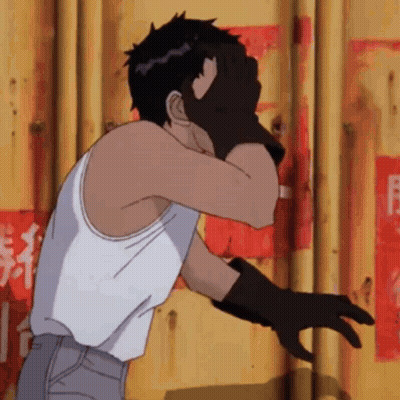 Man In White Tank Top And Black Gloves Facing Yellow Wall GIF