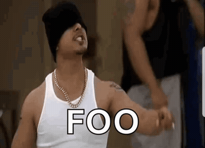 Man In White Tank Top And Black Hat Standing In Front Of Crowd GIF