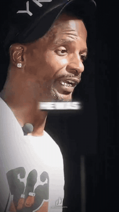 Man In White Tank Top And Blue Hat Holding Chain With Letter O GIF
