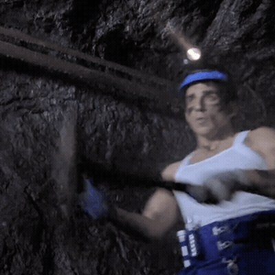 Man In White Tank Top And Blue Helmet Holding Hammer GIF