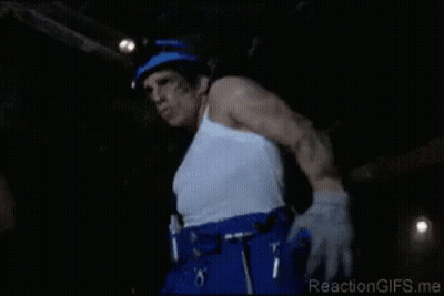Man In White Tank Top And Blue Pants In Dark Room GIF