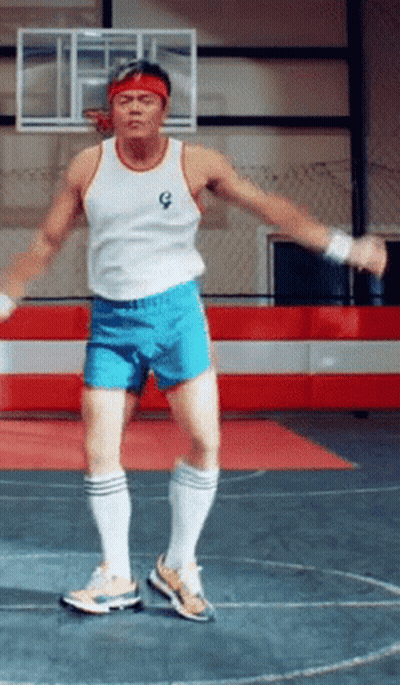 Man In White Tank Top And Blue Shorts Jumping GIF