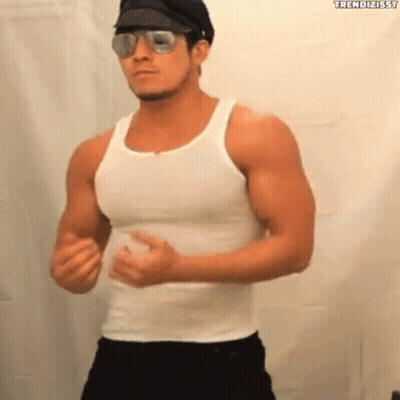 Man in White Tank Top and Sunglasses Dancing
