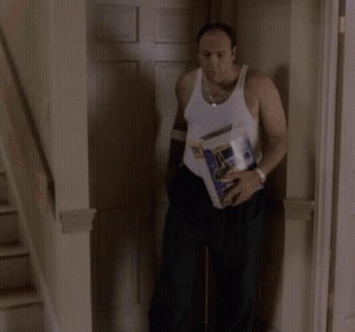 Man In White Tank Top Carrying Box With Bottle GIF
