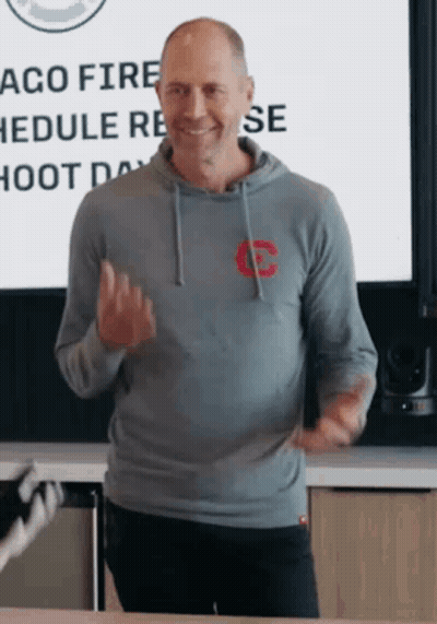 Man In White Tank Top Dancing In Front Of Crowd GIF