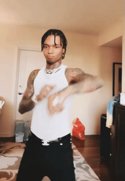 Man In White Tank Top Dancing In Living Room GIF