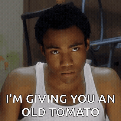 Man In White Tank Top Giving Old Tomato GIF