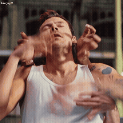 Man In White Tank Top Held By Another Man GIF