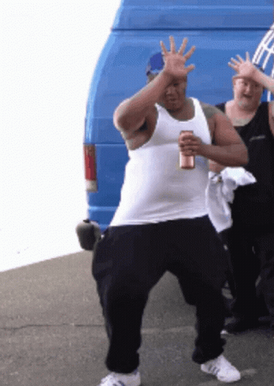 Man In White Tank Top Holding Beer GIF