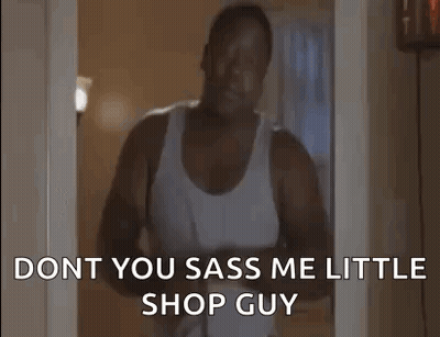 Man In White Tank Top Holding Hair Dryer Talking GIF