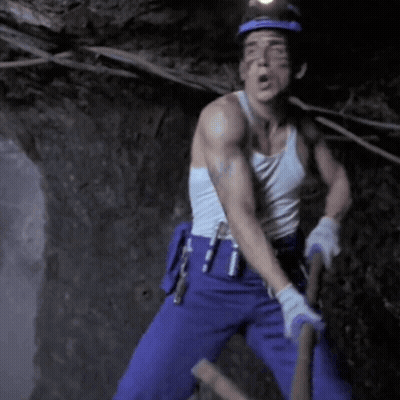 Man In White Tank Top Holding Hammer GIF