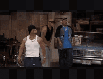 Man In White Tank Top In Front Of Blue Car With License Plate J94107 GIF
