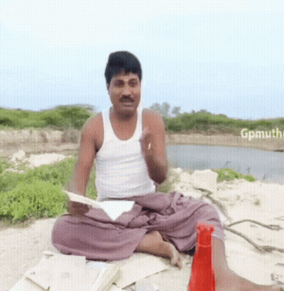 Man In White Tank Top Lotus Position Holding Paper GIF