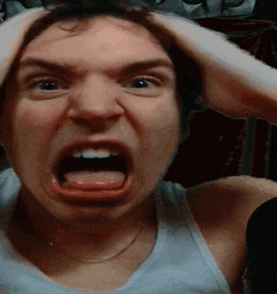 Man In White Tank Top Making Funny Face GIF