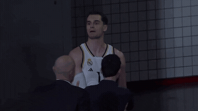 Man In White Tank Top Next To Man In Blue Shirt GIF