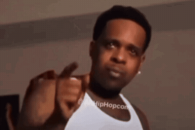 Man In White Tank Top Pointing At Camera GIF
