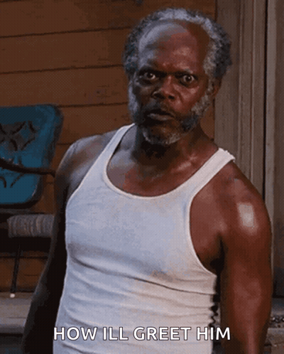 Man In White Tank Top Saying How Ill Greet Him GIF