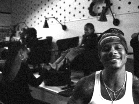 Man In White Tank Top Smiling In Room GIF