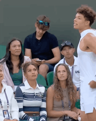 Man In White Tank Top Standing In Stadium GIF