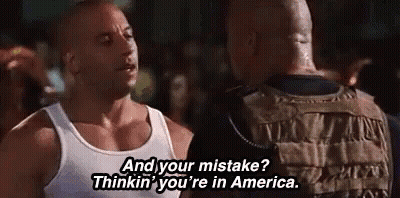 Man In White Tank Top Talking To Another GIF