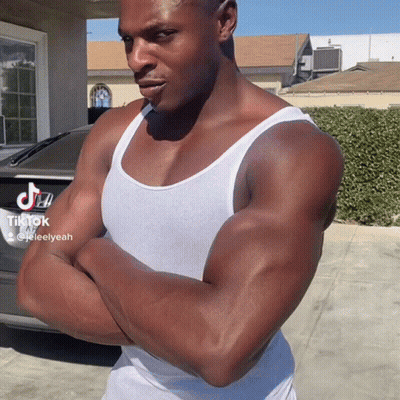 Man In White Tank Top With Arms Crossed GIF