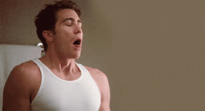 Man In White Tank Top With Eyes Closed GIF
