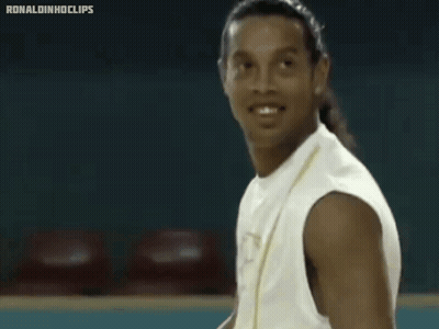 Man In White Tank Top With Letter P Smiling GIF