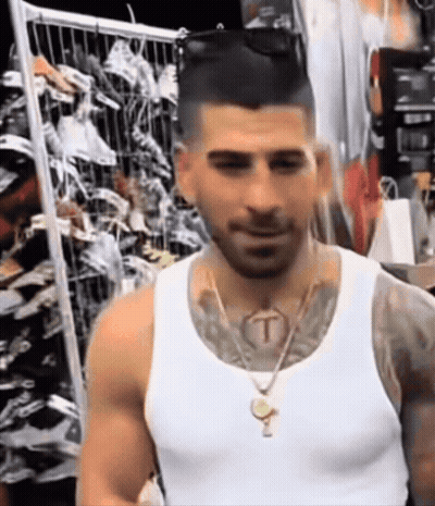 Man In White Tank Top With T Tattoo On Neck GIF