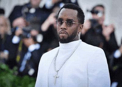 Man In White Turtleneck And Cross Necklace GIF