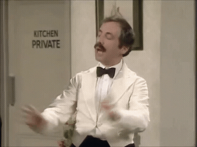 Man In White Tuxedo Dancing In Front Of Kitchen Private Sign GIF