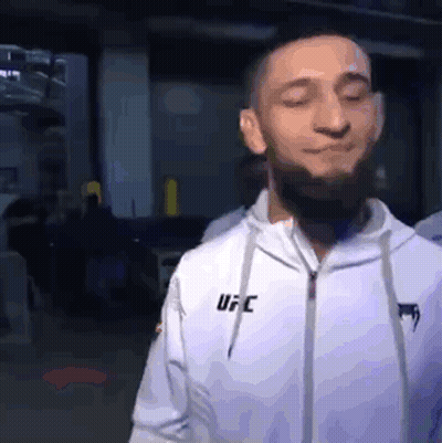 Man In White UFC Jacket Eyes Closed GIF