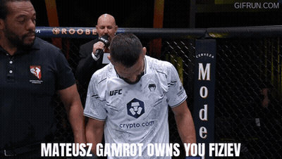 Man In White UFC Shirt With Referee GIF