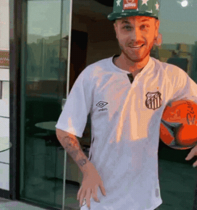 Man In White Umbro Shirt Holding Orange Soccer Ball GIF