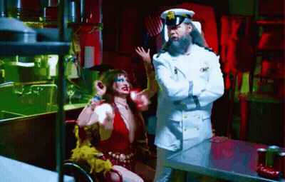 Man In White Uniform Next To Woman GIF
