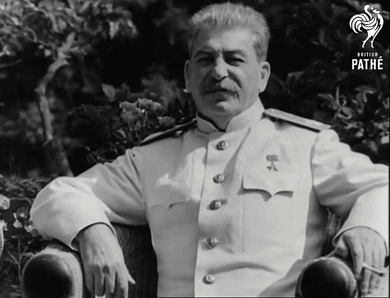 Man In White Uniform Sitting In Chair GIF