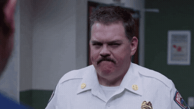 Man In White Uniform With Mustache Making Funny Face GIF