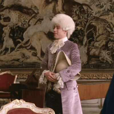 Man In White Wig And Purple Coat Holding Hat GIF